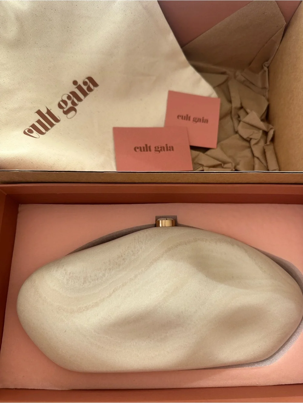 cult gaia cream sculptural stone clutch with gold clasp